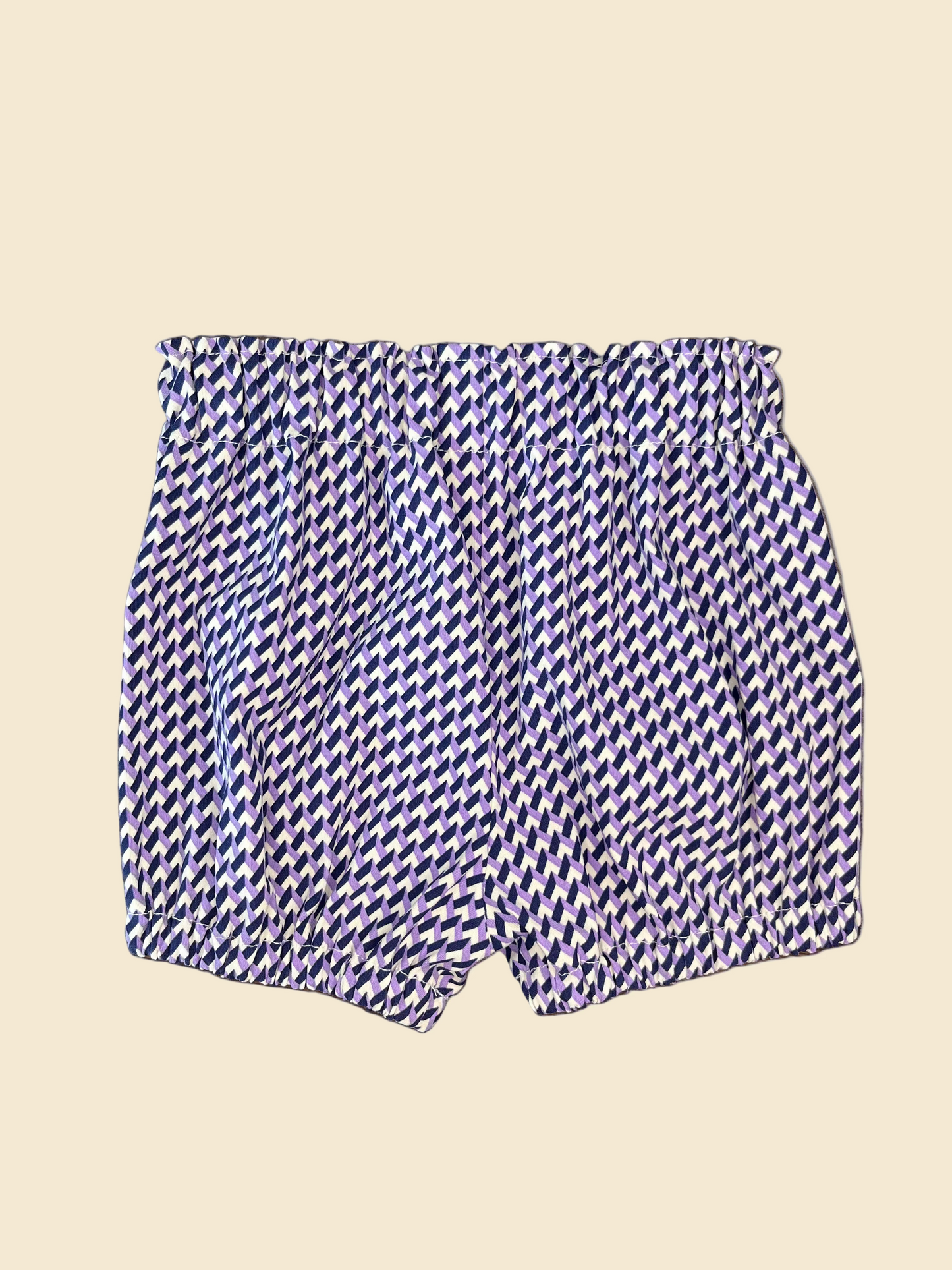 Pair of baby bloomers featuring white, purple and navy geometric fabric.